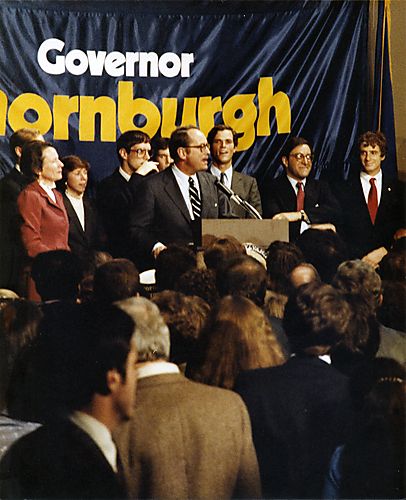 Thornburgh speaking at re-election night celebration, with family and Jay Waldman