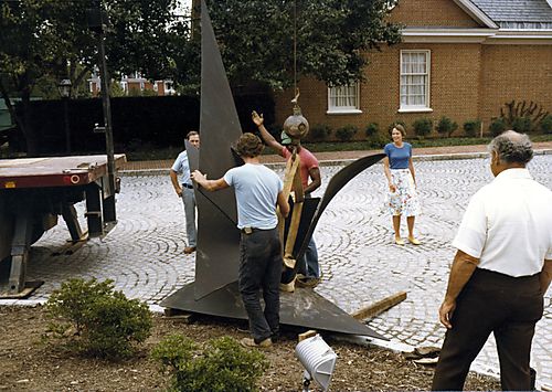 Ginny Thornburgh observing the installation of the Alexander Calder sculpture