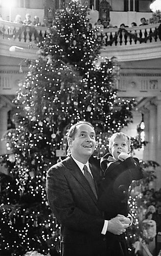 Governor Thornburgh with Joshua Mock in front of the capitol Christmas Tree