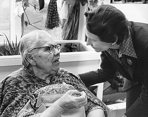 Ginny Thornburgh talking with senior woman