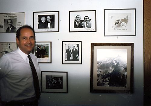 Thornburgh in front of IOP office picture wall