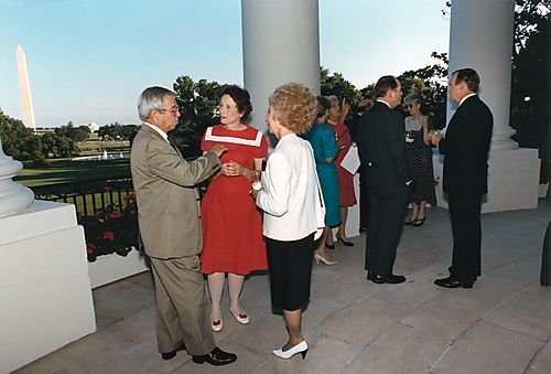 Attorney General Thornburgh and Ginny on White House balcony overlooking the Washington Monument at cabinet dinner