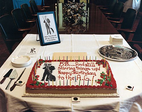 "Still Stirring Things Up" decorated birthday cake for Attorney General's 58th birthday celebration
