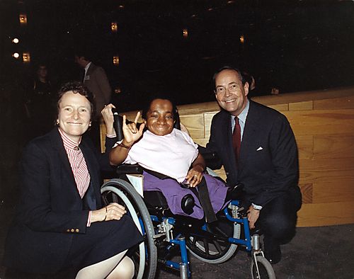 Attorney General and Ginny Thornburgh speak to friend at the Boston Center for Independent Living