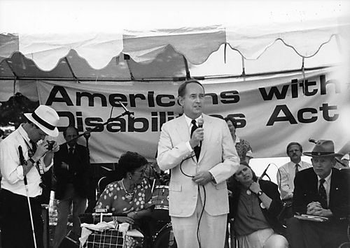 Speaking to disability advocates after the signing of the Americans with Disabilities Act (ADA)