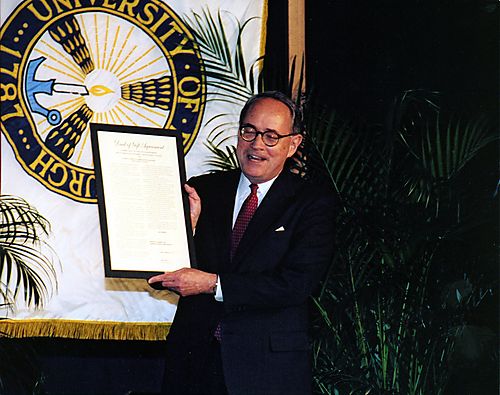 Thornburgh holding the Deed in which he donated the Dick Thornburgh Archival Collection to the University of Pittsburgh