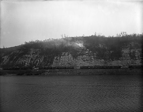 A Train Runs Along the River