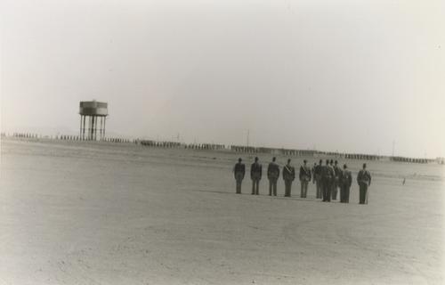 Soldiers Facing Water Tower and Groups of Soldiers