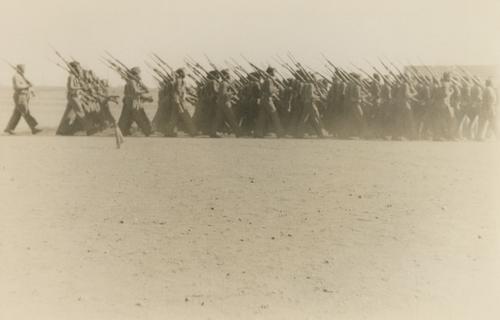 Close-Up Side View of Soldiers Carrying Rifles