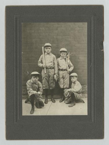Stanley M. Rinehart Jr. [?] as a child, in baseball uniform with teammates