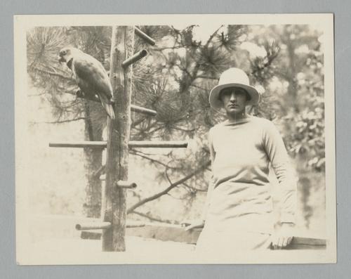Gratia Houghton Rinehart outdoors with parrot and fishing
