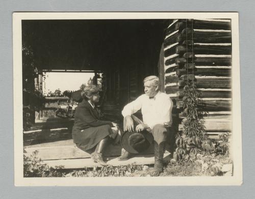 Unidentified man and woman at cabin at Eatons' Ranch