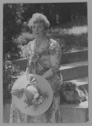 Mary Roberts Rinehart portraits in floral dress, outside