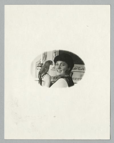 Mary Roberts Rinehart portrait indoors with bird