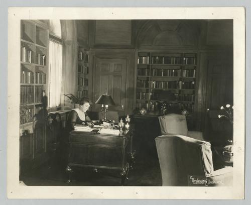 Mary Roberts Rinehart working at desk