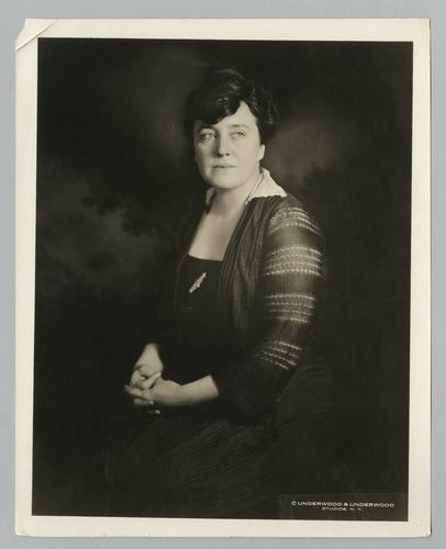Mary Roberts Rinehart portrait in black dress with jeweled pin