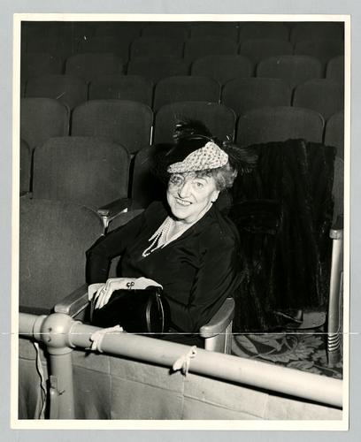 Mary Roberts Rinehart in theater seat