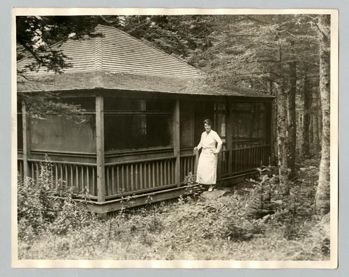 Mary Roberts Rinehart outside cabin in Maine