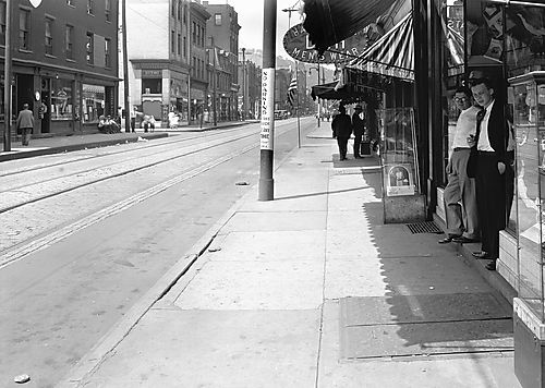 Two Men at a Storefront