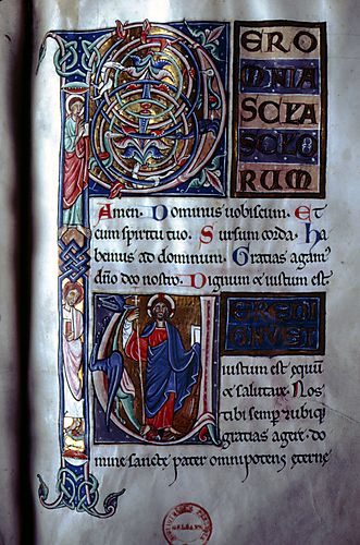 f. 71: Foliate initial P with two saints; initial U with Christ holding cross staff