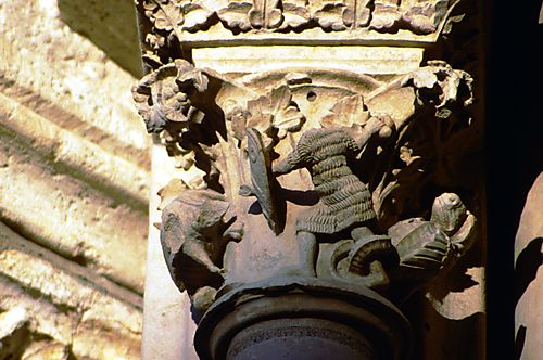Historiated Capital- Knight fights a grotesque creature