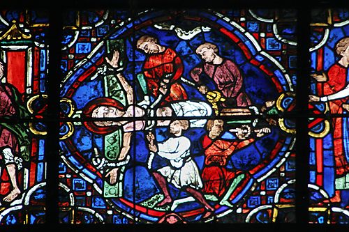 29: Andrew is attached  to a cross 