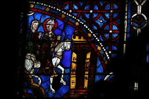 7: Becket(?) on horseback arrives at a town