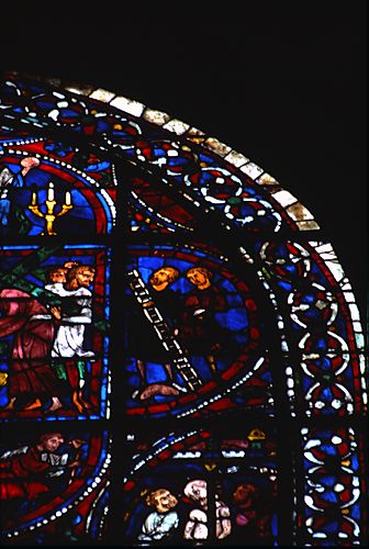 7: Two men, one of whom holds a ladder