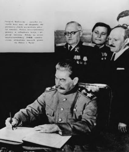 [Stalin signs a treaty between the Soviet Union and Poland]