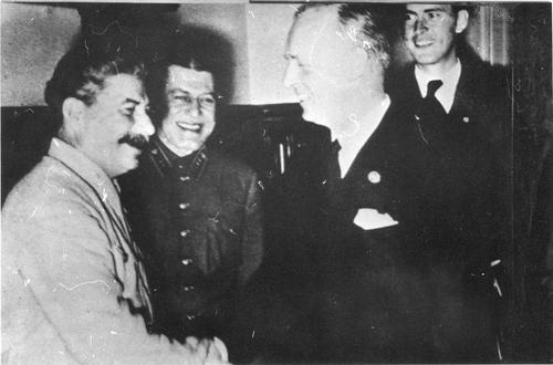 [Stalin and Joachim von Ribbentrop during the signing of the Non-Aggression Pact between the Soviet Union and Germany]