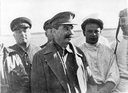 [Stalin during a meeting with the pilots of the first trans-polar flight, V. Chkalov, A. Beliakov, and G. Baidukov]