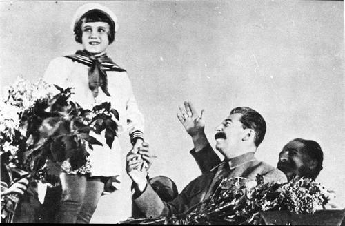 [Stalin and a young pioneer]