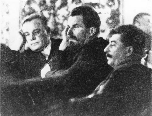 [During the Second Session of the Central Executive Committee of the USSR. From left to right: an unindentified man, A. Rykov, Stalin]